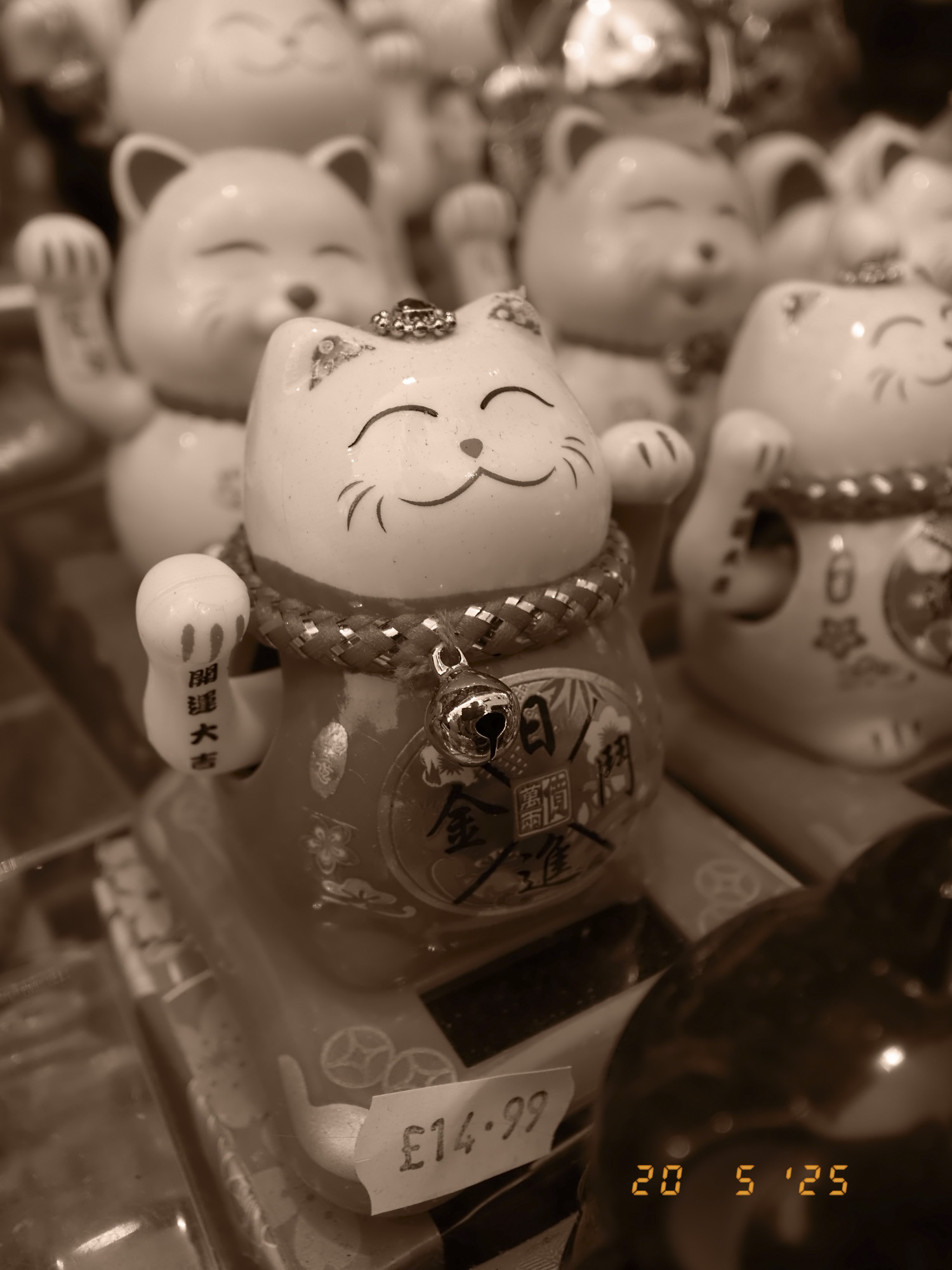 Closeup of maneki-neko in London's china town