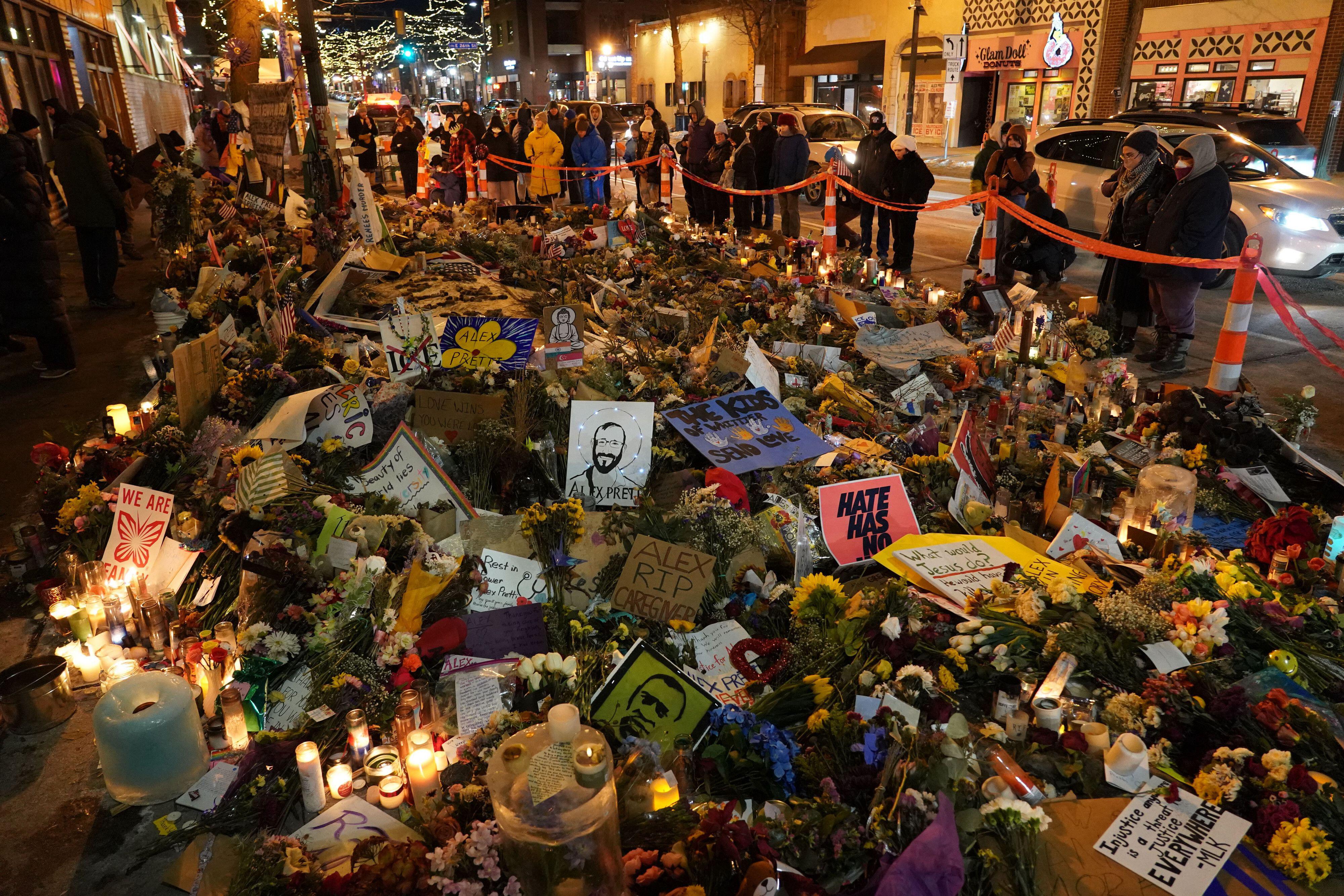 People visit the memorial of Alex Pretti, who was fatally shot by ICE agents on January 24, in Minneapolis, Minnesota.