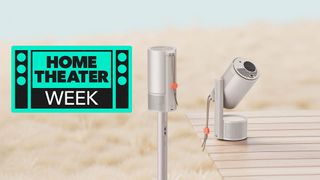 Xgimi Mogo 3 Pro outdoors with a sign saying Home Theater Week