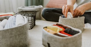 decluttering and sorting items into storage to suggest how to create a stress-free home
