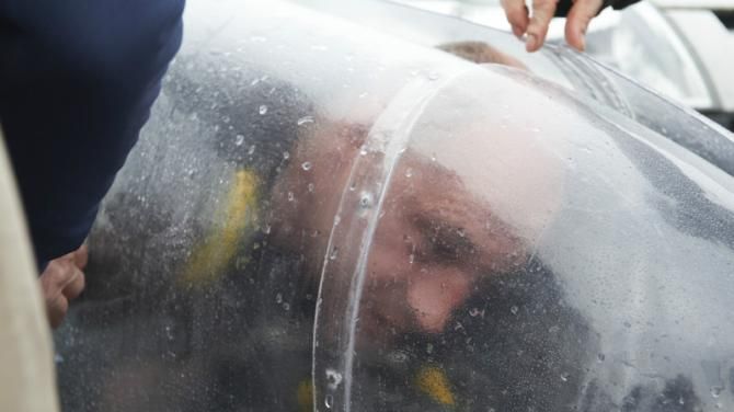 Graeme Obree inside the aerodynamic shell of the Beastie