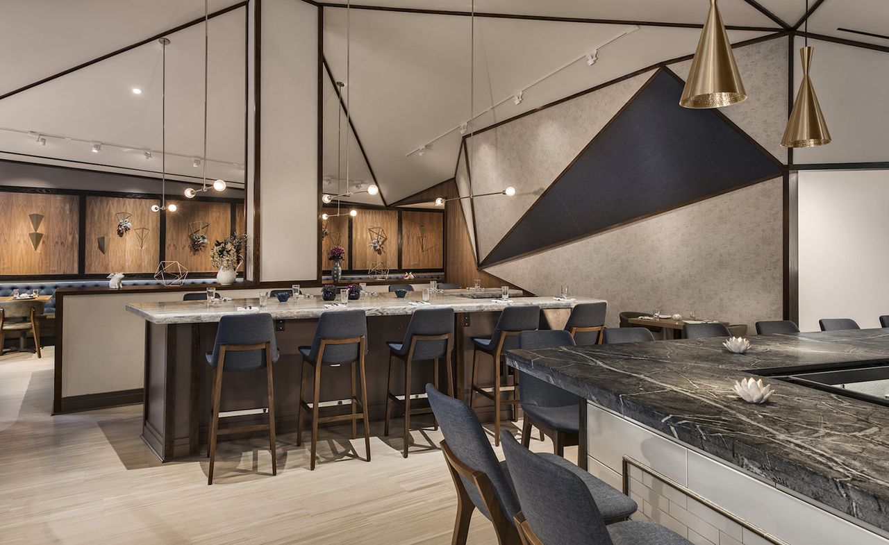 restaurant with wooden flooring and grey seating 