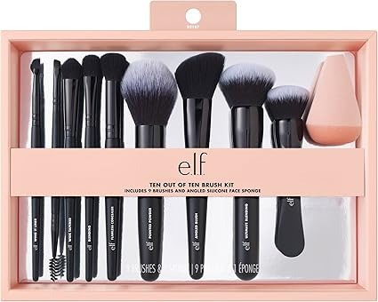 Pink packaging with nine black makeup brushes and a sponge in it