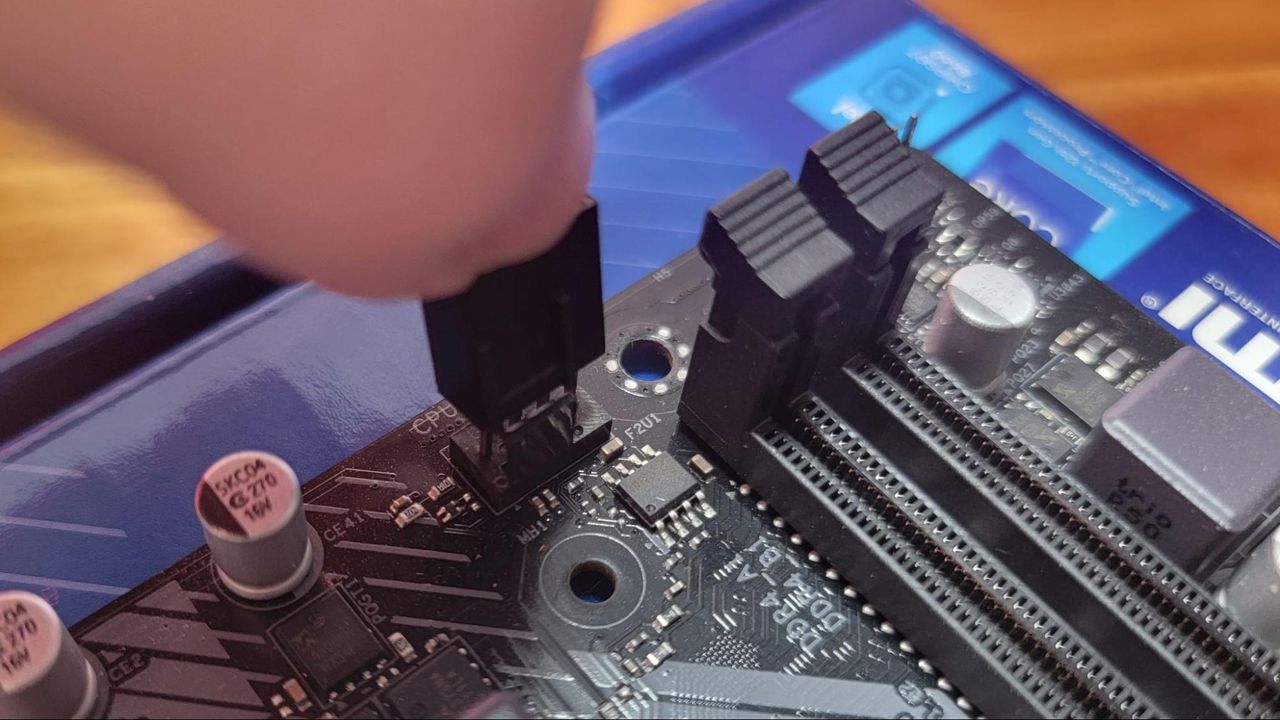 Plugging the CPU fan into the motherboard