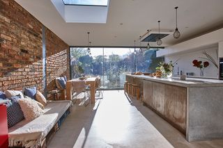 open plan kitchen, diner and living area with an industrial feel and sliding doors