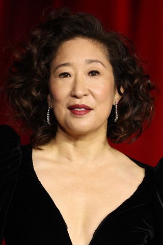 Sandra Oh is pictured with warm brown curls at The Fourth Annual Academy Museum Gala at Academy Museum of Motion Pictures on October 19, 2024 in Los Angeles, California.