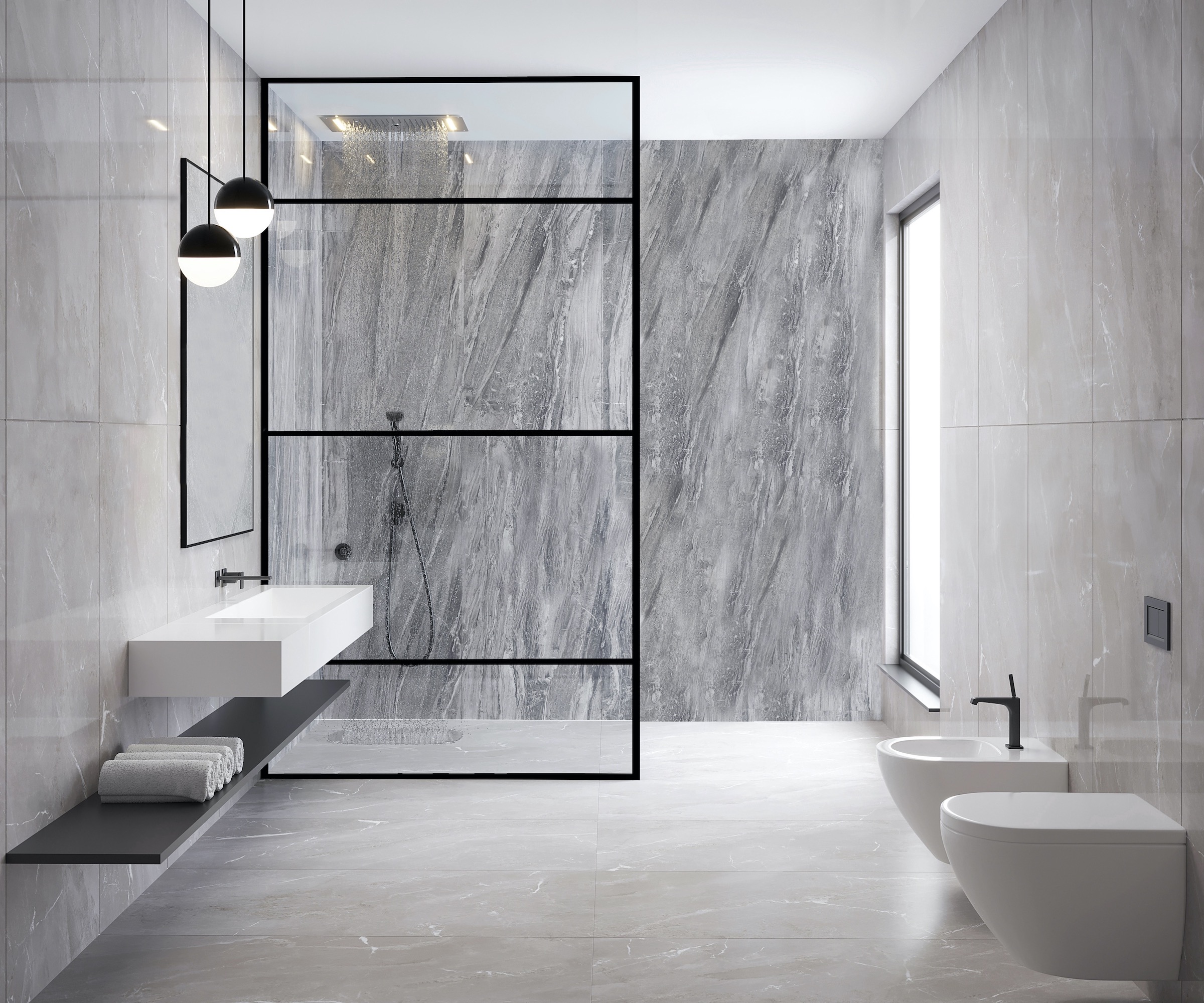 Black framed shower screen in a marble-effect tiled shower room