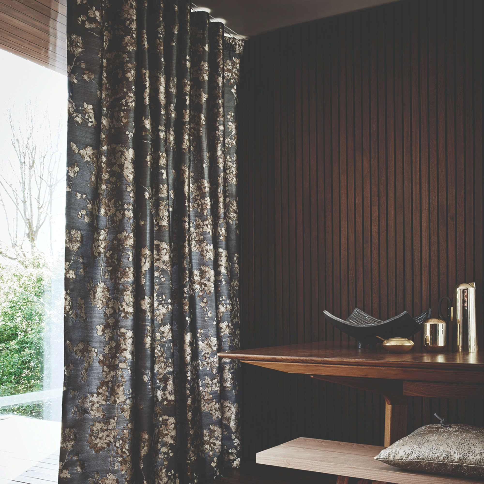 Heavy patterned curtains in brown room