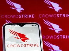 red crowdstrike logo on smartphone with red background