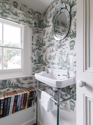 Bathroom with traditional sink and white and green wallpaper