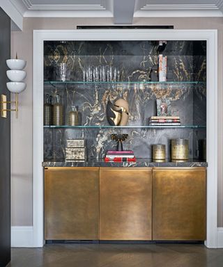 Home bar with countertop and backsplash in dark marble