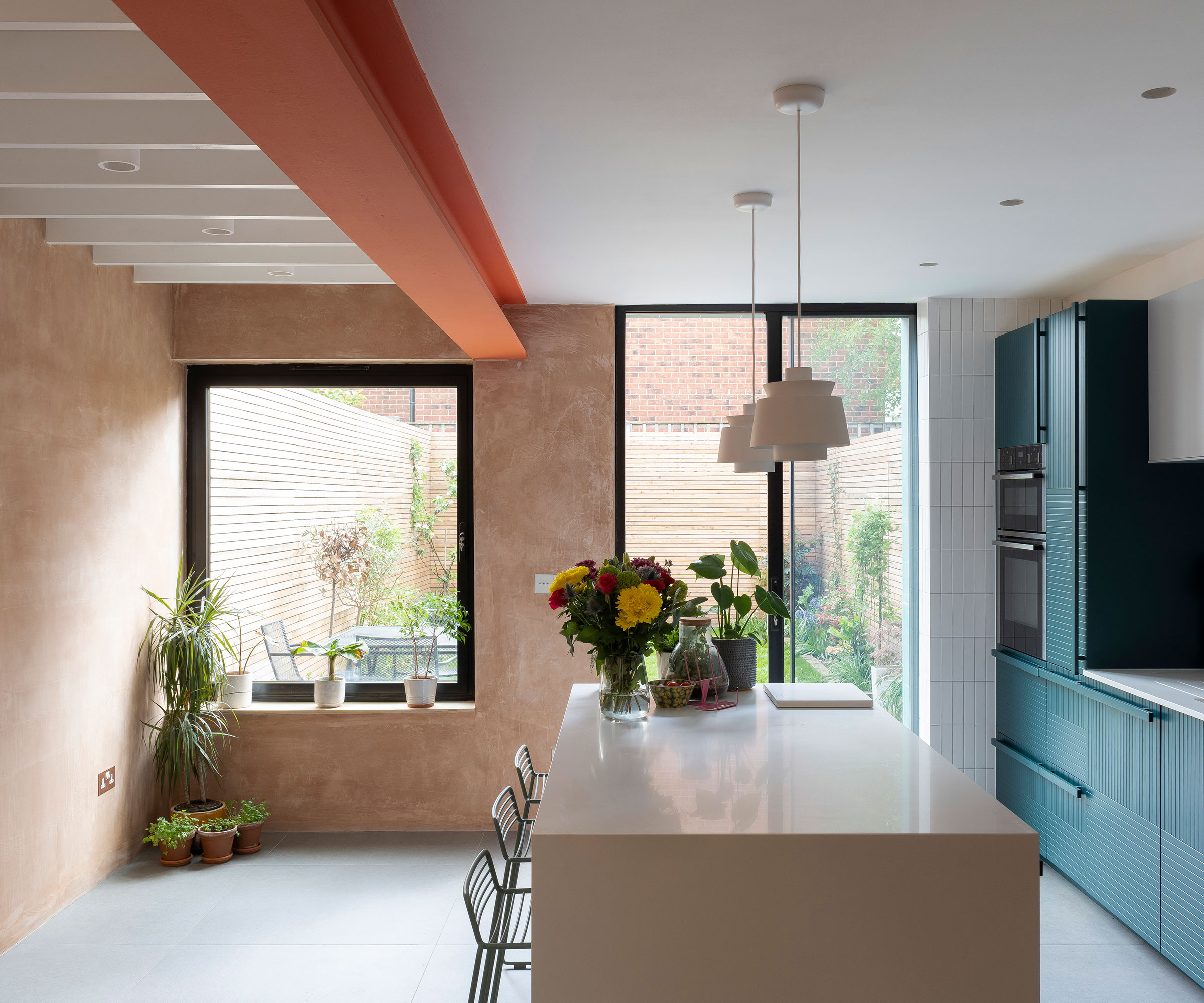 modern side return extension interior with blue kitchen