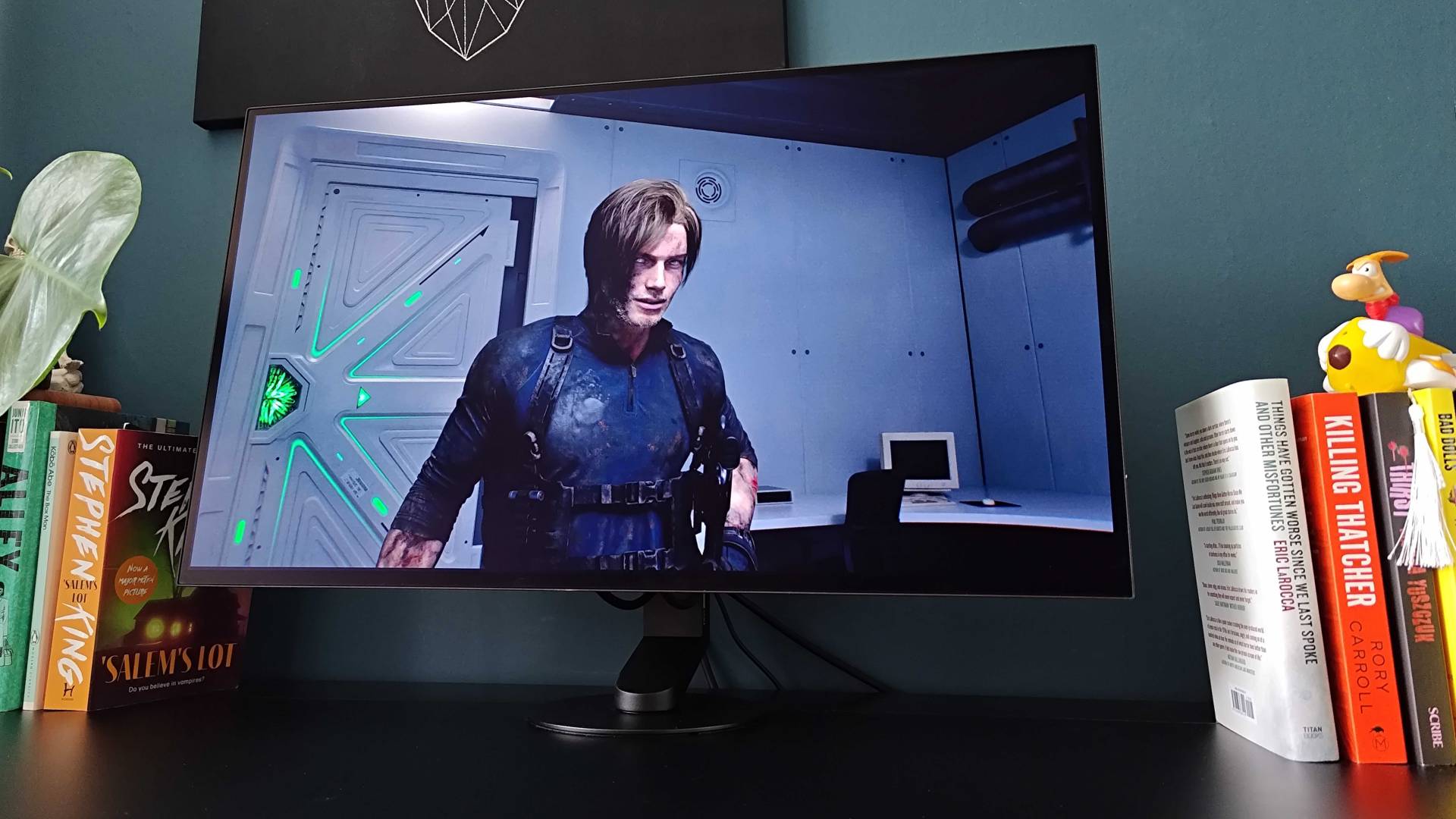 Sony Inzone M10S II with Resident Evil Requiem gameplay on screen featuring Leon Kennedy looking at camera.