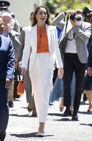 Kate Middleton's white suit—Catherine, Duchess of Cambridge is seen during visit to Shortwood Teacher's College on March 23, 2022 in Kingston, Jamaica.