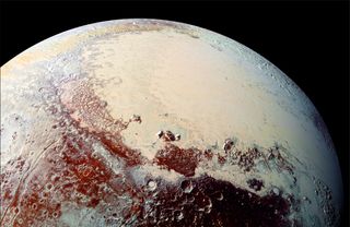 close up of pluto with rippled terrain and an ice cap visible below