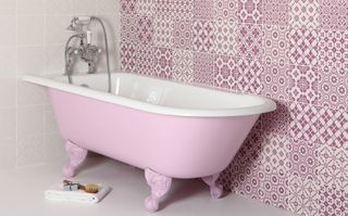 pink bath in pink tiled room