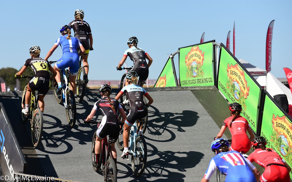 The lead women cross a fly-over on the first lap