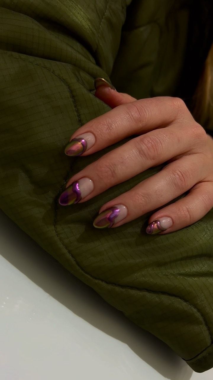 A picture of purple chrome nail art