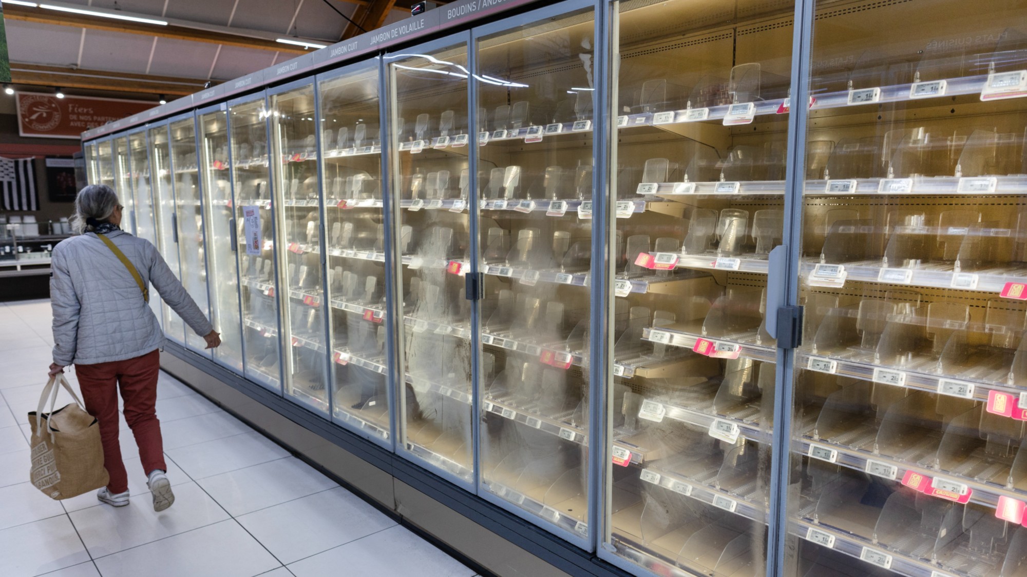 Empty shelves at a French supermarket following a cyberattack.