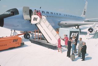 Braniff International Airways with passengers boarding the flight