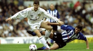 16 Oct 1999: Michael Bridges of Leeds United (left) challenges Danny Sonner of Sheffield Wednesday during the FA Carling Premiership match at Elland Road, England. Leeds won the game 2-0.