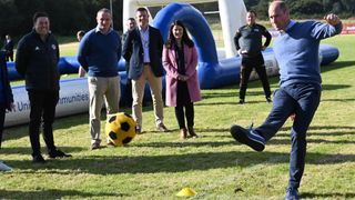 Prince William, Duke of Cambridge kicks a football
