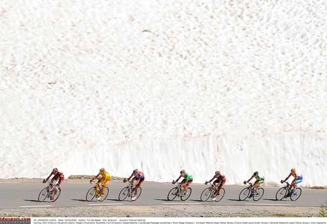 The colors of the peloton up against a glacier in 2009