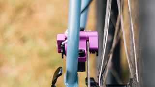 A purple Paul Klamper brake calliper on a blue frame
