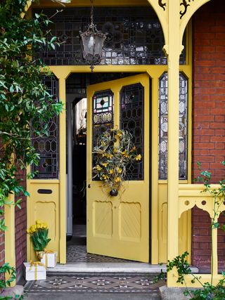 yellow victorian front door