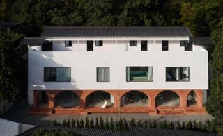 A clutch of old red-bricked residences into a three-storey complex