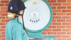 Rider-looking-at-scales_128739431_219000222.jpg