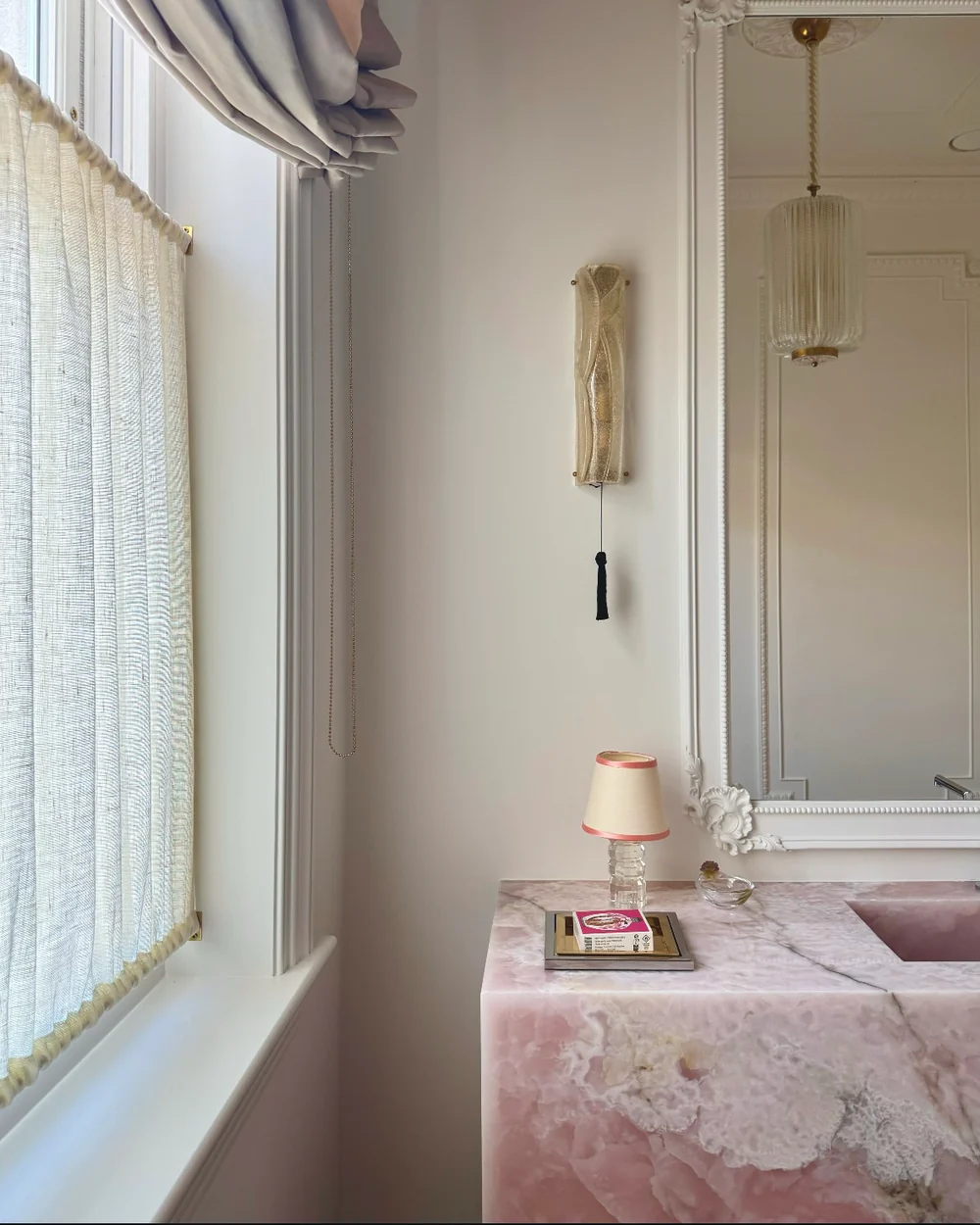 Glass bathroom wall light with handwoven passementerie light pull and tassel