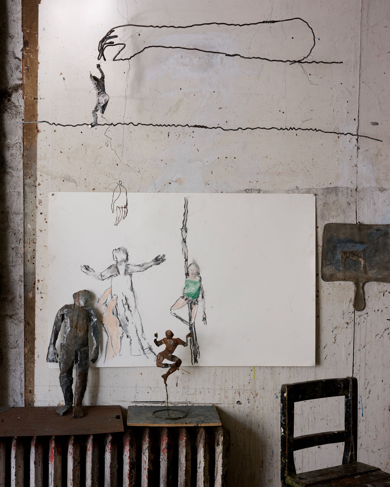 Sculpted figures and paintings in June Leaf's studio