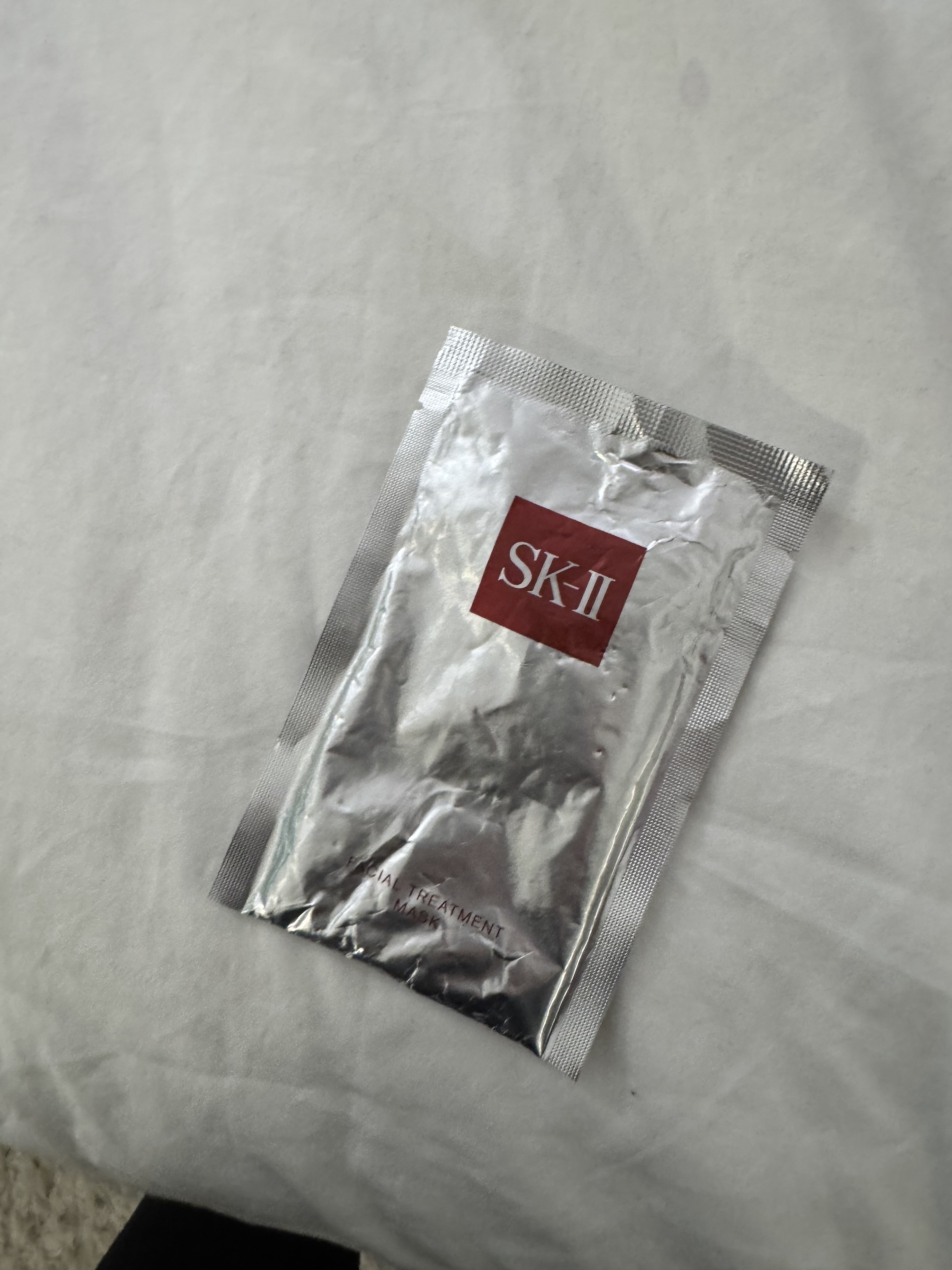red and silver face mask packet