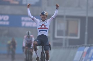 British Thomas Pidcock celebrates as he crosses the finish line to win the mens elite race at the Cyclocross World Cup cyclocross event in Rucphen The Netherlands Saturday 18 December 2021 the ninth stage out of 16 in the World Cup of the 20212022 seasonBELGA PHOTO DAVID STOCKMAN Photo by DAVID STOCKMANBELGA MAGAFP via Getty Images