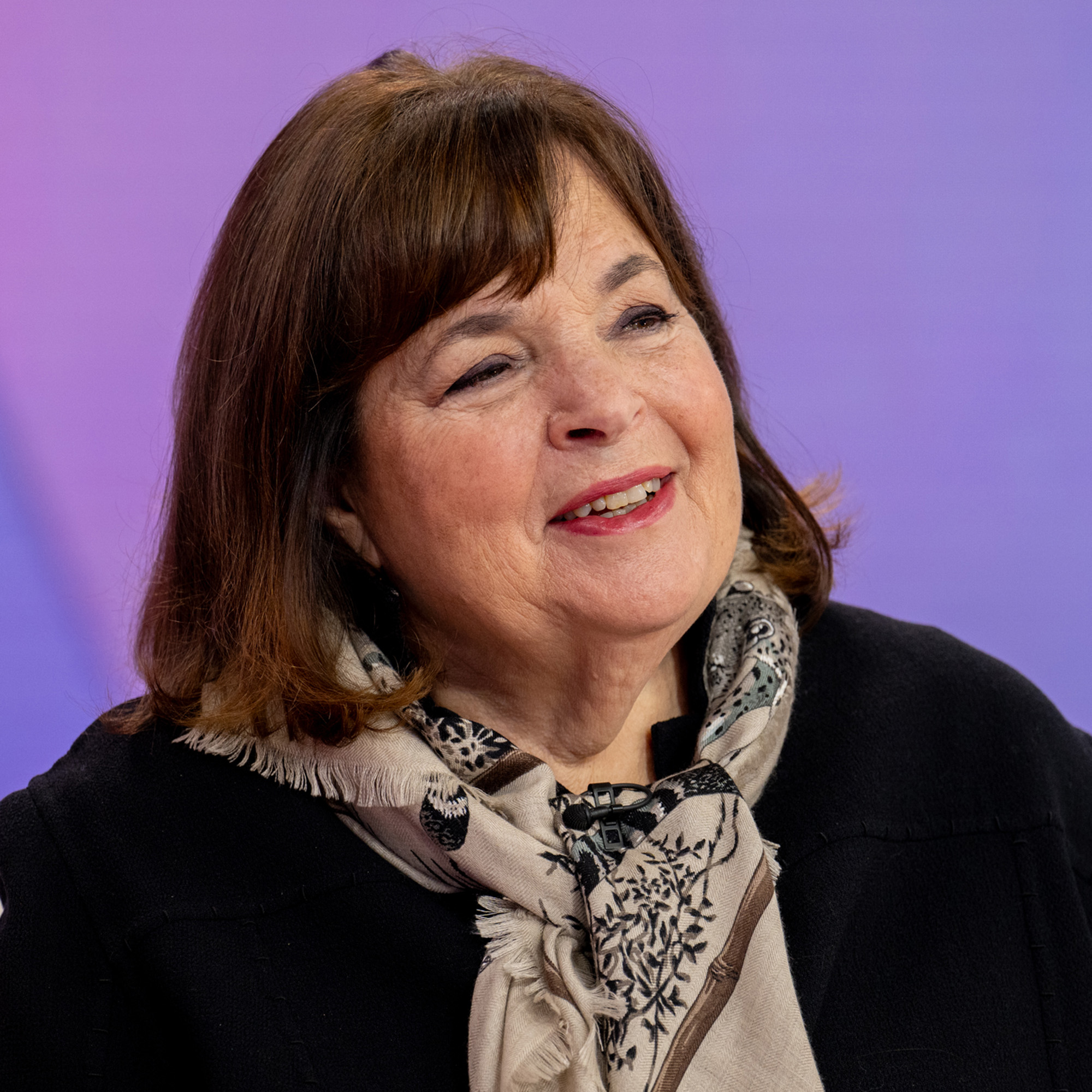 Ina Garten in front of purple background