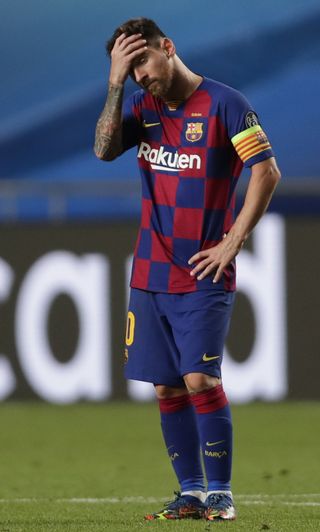 Lionel Messi holds his head as Bayern Munich run riot