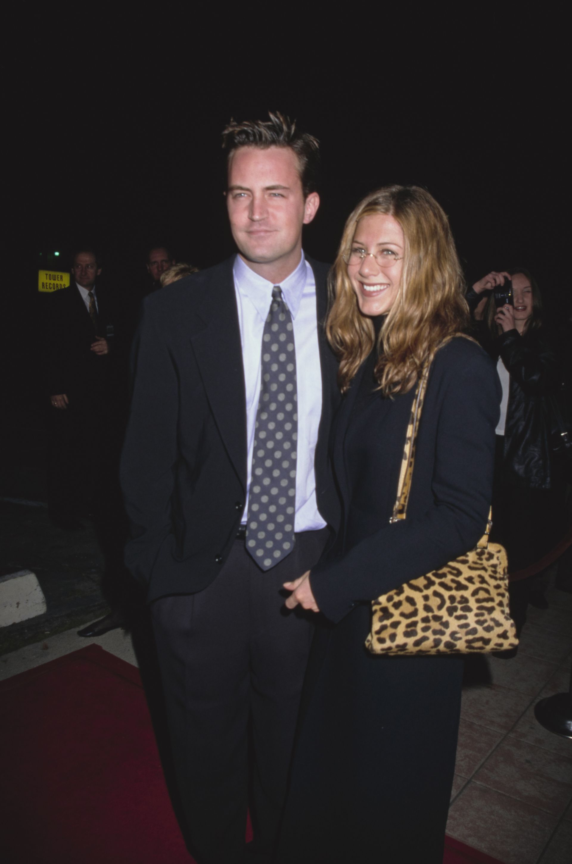 Jennifer Aniston carrying a leopard bag.