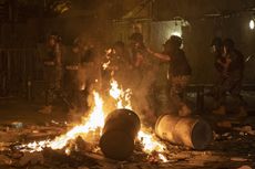 Riot police clash with anti-government protesters in Beirut.