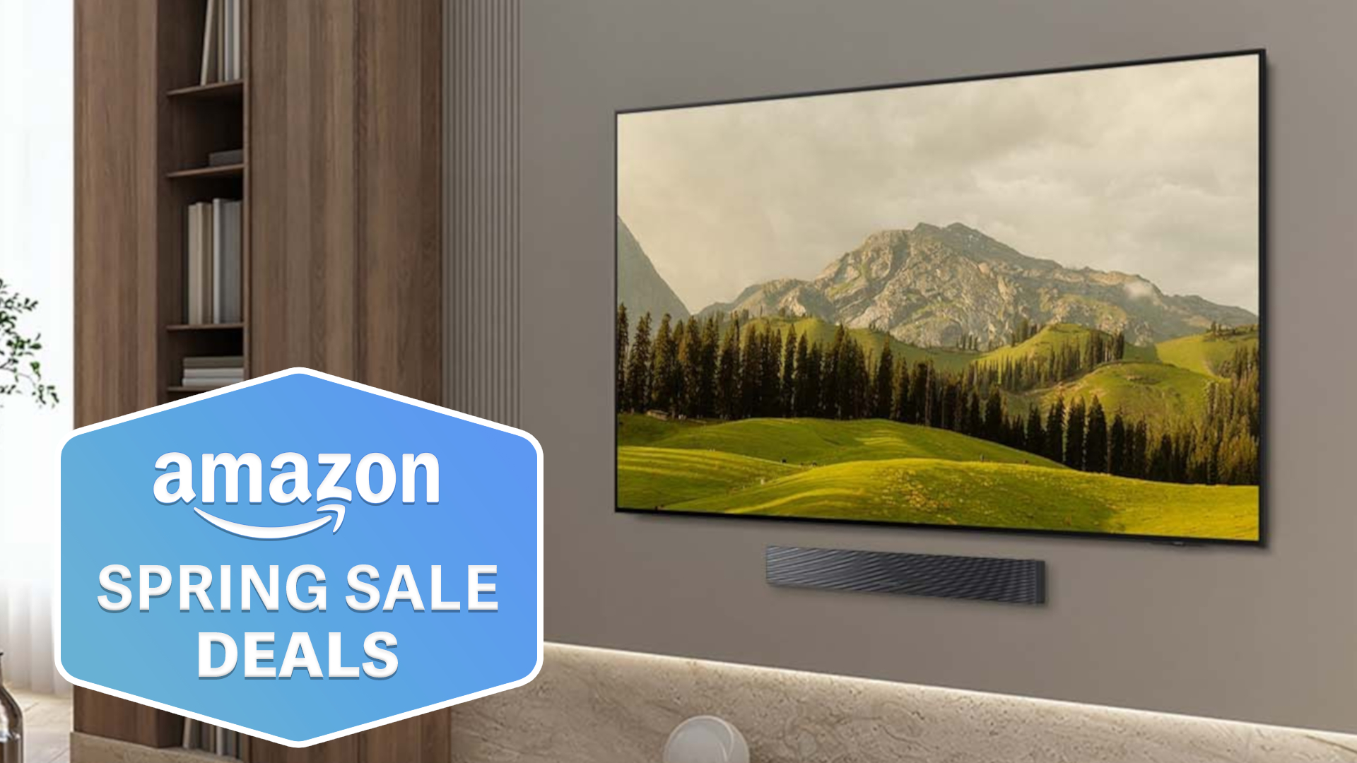 The Samsung S85F OLED TV displaying a green-colored mountain scene from a wall-mounted position in a modern living space. To the left of the TV is a superimposed, blue-colored badge that reads: "Amazon Spring Sale Deals".