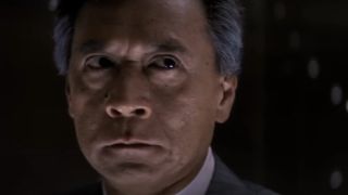 James Shigeta as a fearful Joseph Takagi in Die Hard