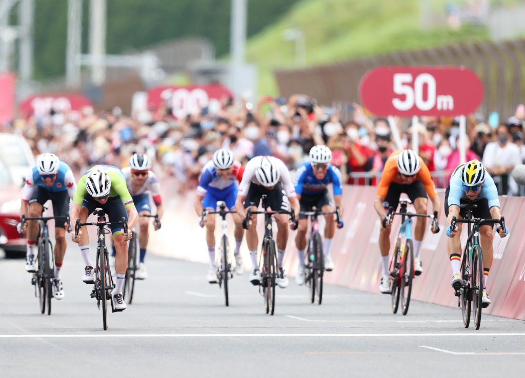 OYAMA JAPAN JULY 24 LR Tadej Pogacar of Team Slovenia bronze medal Wout van Aert of Team Belgium silver medalist sprints on arrival during the Mens road race at the Fuji International Speedway on day one of the Tokyo 2020 Olympic Games on July 24 2021 in Oyama Shizuoka Japan Photo by Michael SteeleGetty Images