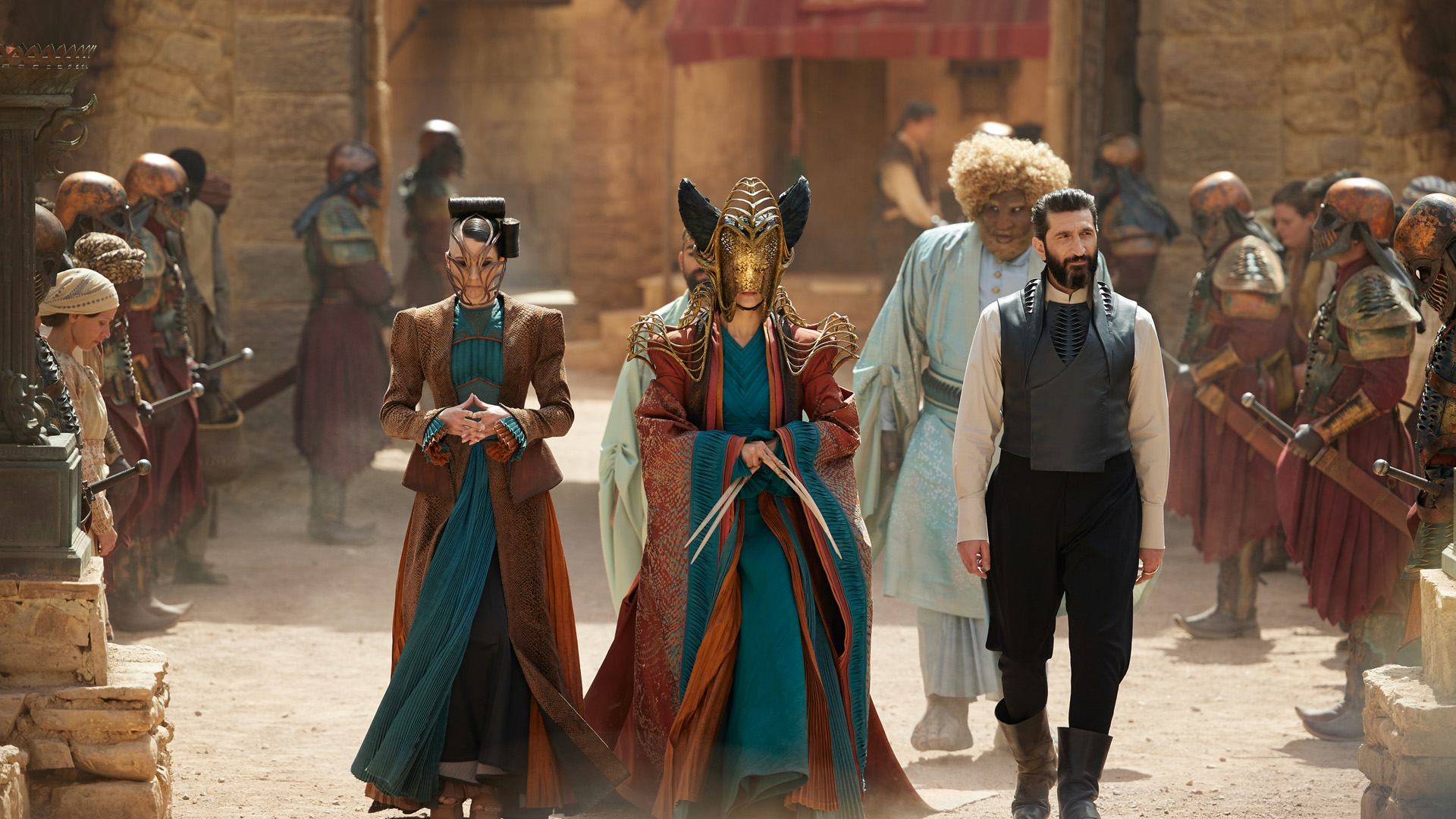 Some of the Seanchan walk through a street in their main headquarters in The Wheel of Time season 2