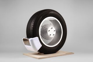 Black tire with white box attached