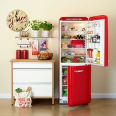 kitchen with white wall and red refrigerator 