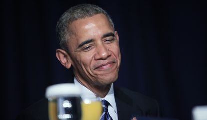 Obama chuckles. 