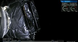 This view from a camera on SpaceX's Falcon 9 second stage shows the Es'Hail-2 satellite as it rides into space.