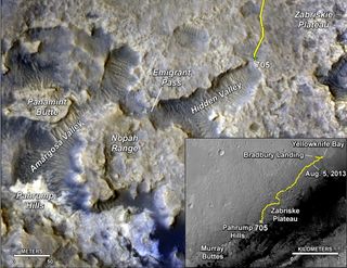 The main map displays the assortment of landforms near the location of NASA's Curiosity Mars rover, which has been on the red planet for almost 2 years. The gold traverse line starting at the upper right ends at Curiosity's position as of the 705th Martian day of the mission, July 31, 2014. The inset map tracks the mission's entire route from the landing on Aug. 5, 2012, PDT (Aug. 6, UTC) to Sol 705.