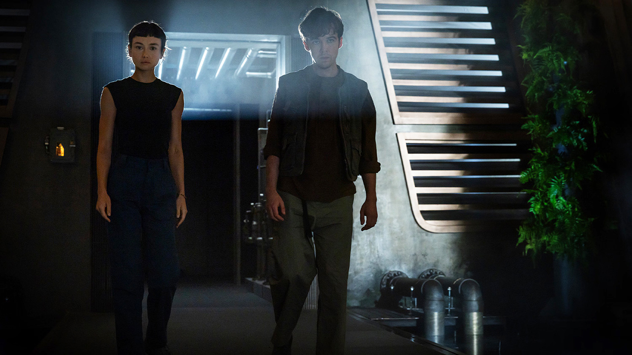 Wendy and Joe standing in a dimly-lit room in Alien: Earth season 1 episode 8
