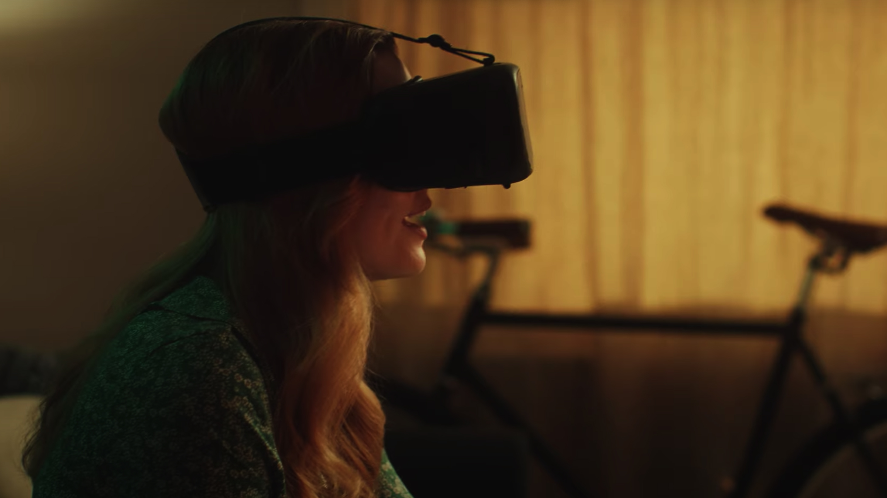 A woman wearing a VR headset using Canon Kokomo software